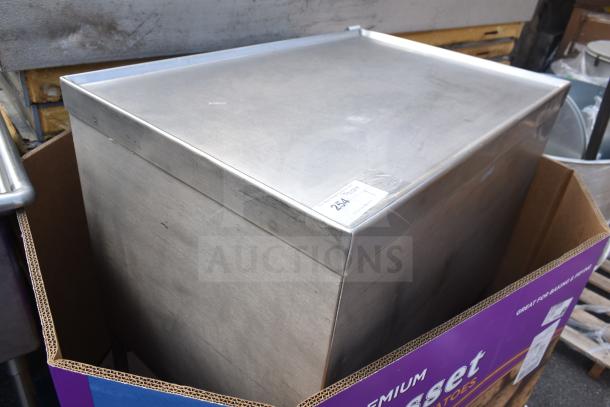 Stainless steel commercial counter with drawer, under shelf, and baskets. Slightly worn. Label reads "254".