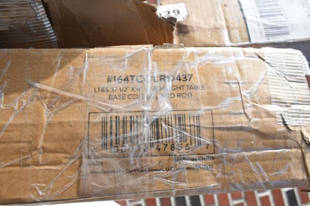 Cardboard box labeled "#164TCOLR0437 LT&S 37 1/2” X 4” Table Base Column Rod, Made in China."