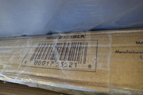 Cardboard box with barcode "00017 55521" and item code "164KB3Z3BLK" visible, wrapped in plastic.