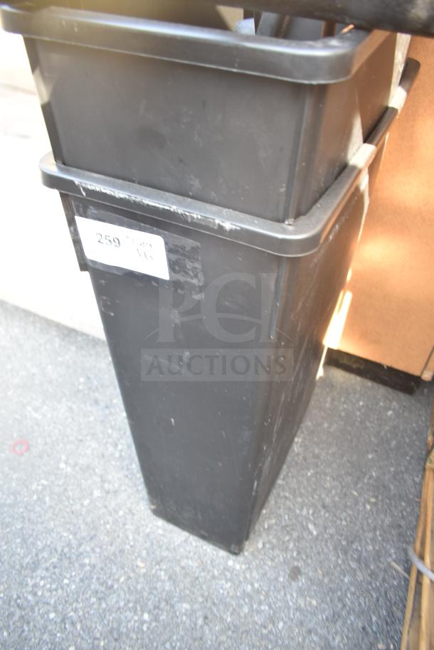 Poly trash can in good condition with a visible label marked "259". Includes table base pieces, 5 times your bid.