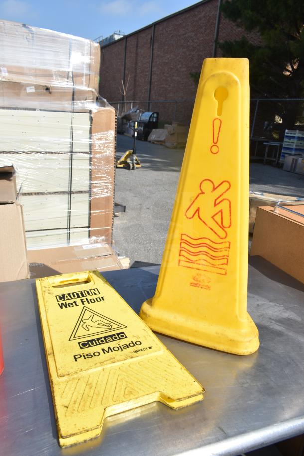 Commercial table with wet floor caution signs. Includes content such as fire extinguishers and dolly. Good condition.