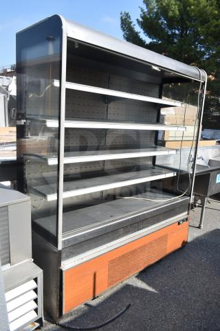 Commercial Grab N Go Merchandiser with multiple shelves, glass sides, and a wooden exterior base panel, in used condition.