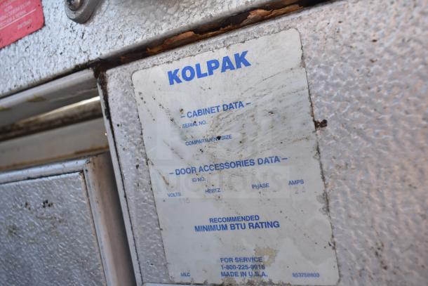 Kolpak Walk-In Box label with specifications. Includes voltage, phase, and made in USA markings. Worn and rust visible.