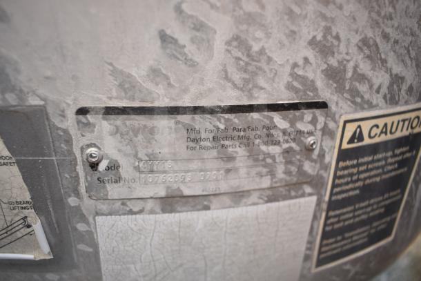 Dayton 4YY18 metal commercial mushroom exhaust fan label, showing model and serial number; weathered condition.