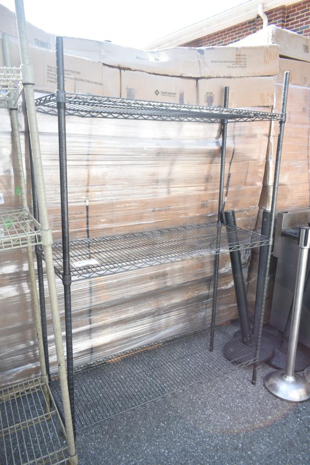 Black finish 3 tier wire shelving unit, sturdy, must dismantle for transport. Consider freight charges; PCI will not dismantle.