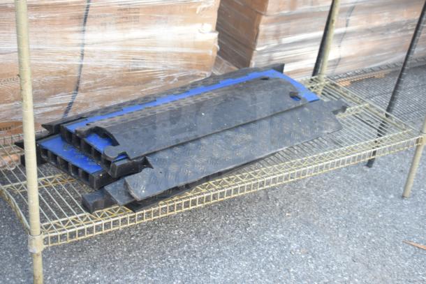 Tan 3-tier wire shelving unit with contents. Buyer must dismantle. Consider freight charges.