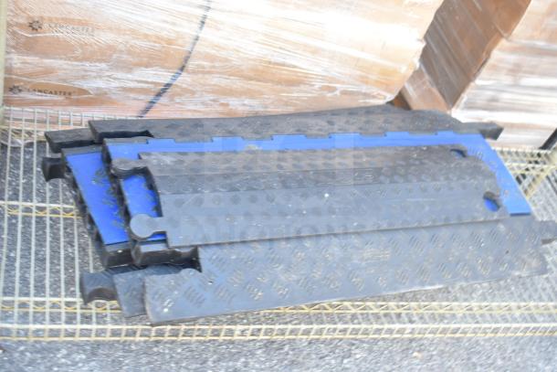 Tan finish 3-tier wire shelving unit with contents, requires dismantling by buyer. Visible contents include black and blue plates.