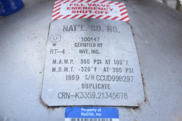 NuCO2 Beverage Carbonation Tank label, showing M.A.W.P. 300 PSI, M.D.M.T. -320°F, certified by MVE, Inc., 1999 model.