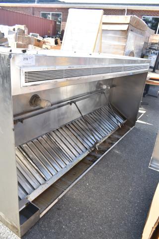 Air Tech 9' commercial return air grease hood with baffle filters and lights. Stainless steel, good condition, visible usage marks.