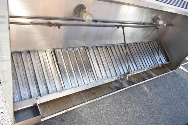 Air Tech 9' commercial return air grease hood with filters and lights, stainless steel, used, showing grease stains.