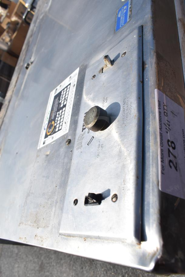 Air Tech 9' commercial grease hood with filters and lights, stainless steel, worn surface, visible control panel and labels.