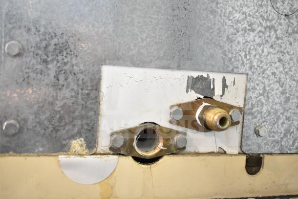 Manitowoc SD0452A commercial ice machine head with visible metallic connections, part of hotel ice dispenser. 115 volts, 1 phase.