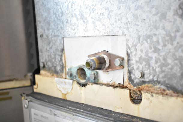 Manitowoc Commercial Ice Machine Head, model SD0452A, with visible wear on piping and connections; suitable for hotel use, 115V, 1-phase.