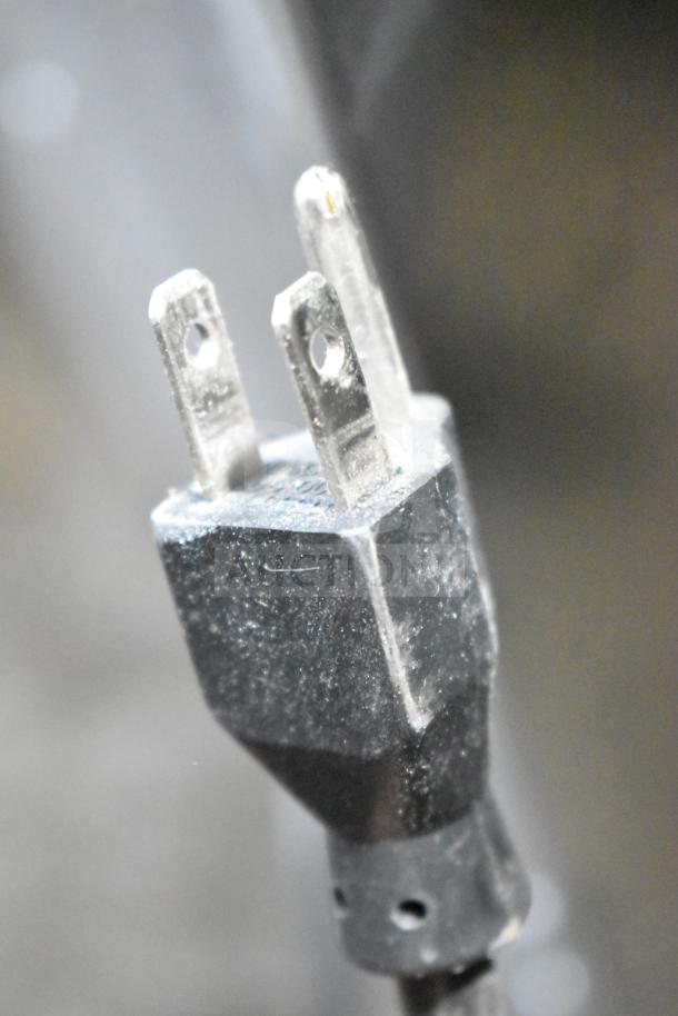 "Close-up of a power plug from a Manitowoc Commercial Ice Machine Head, model SD0452A, requiring 115 volts, 1 phase."