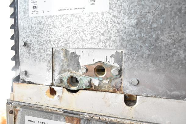 Manitowoc SD0452A ice machine head, visible wear and connections. Model label: SPA310. 115V, 1 Phase.