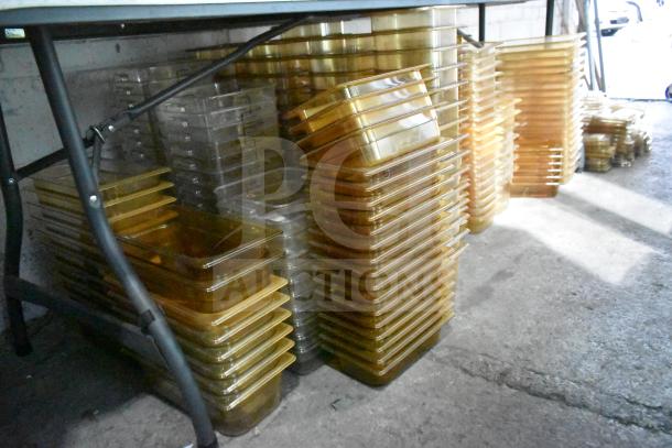 Various brand new amber drop-in bin lids, models FG202P22AMBR, FG221P86AMBR. Includes tabletop and floor items.