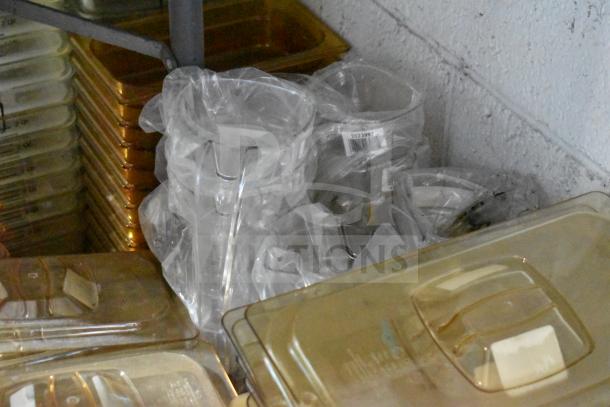 Lot of brand new amber drop-in bin lids, including FG202P22AMBR, FG221P86AMBR. Tabletop and floor items.