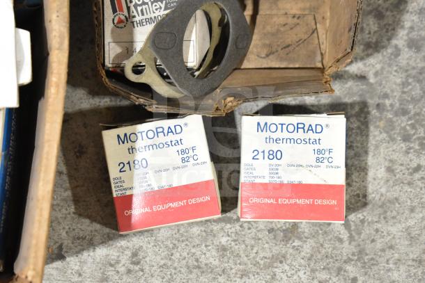 Lot of items including MotoRad thermostats 2180, Fram PH4967 Extra Guard, Napa thermostat, and towel bars.