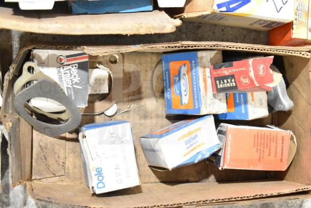 Lot of various items including a Fram PH4967 Extra Guard, Napa thermostat, MotoRad thermostat, towel bars in a box.