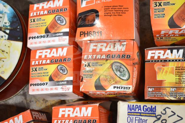 Lot of various items including Fram Extra Guard oil filters (PH4967, PH6811, PH6607, PH7317) and Napa Gold oil filter.