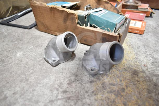 Lot of various items including Fram PH4967 Extra Guard, Napa and MotoRad thermostats, towel bars, in worn packaging.