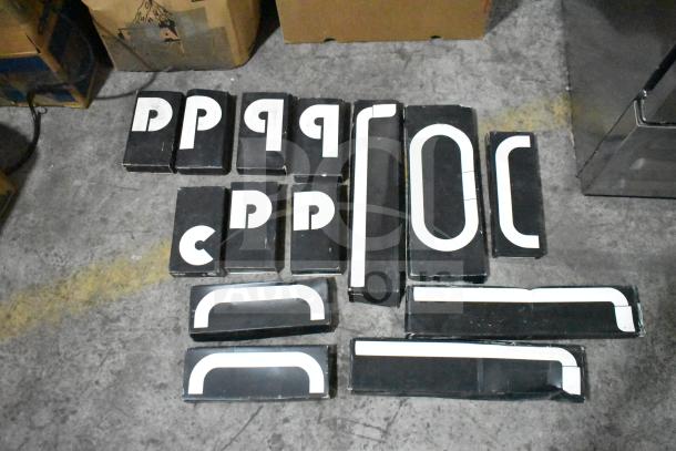 Lot of various boxed items including Fram PH4967 filter, Napa and MotoRad thermostats, and towel bars, displayed on floor.