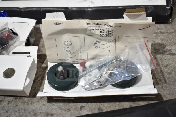 Lot including Fram PH4967 filter, Napa thermostat, MotoRad thermostat, towel bars with HEWI installation instructions.