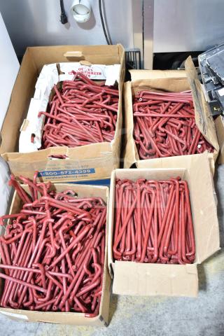 Lot of 4 boxes containing red metal handles. Handles appear new and unblemished. Boxes are slightly worn.