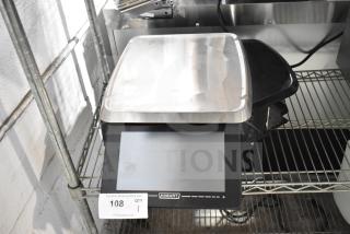 2025 Hobart HTi-7LH4W commercial countertop food portioning scale, tested, no power cord, black and stainless steel.