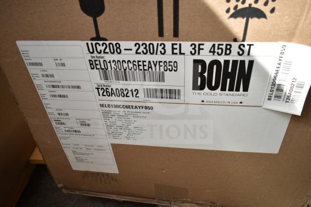 Brand new Bohn BEL0130CC6EEAYF859 evaporator fan packaging. Markings indicate 230 volts, 3 phase. Model and serial number visible.
