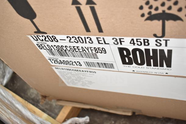 BRAND NEW Bohn BEL0130CC6EEAYF859 evaporator fan, 280V, 3 phase, packaged with label showing model and serial number.