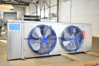 BRAND NEW Bohn BEL0650AG6AMAD2107 evaporator fan, 115 volts, 1 phase. Features two blue fans and branded label.