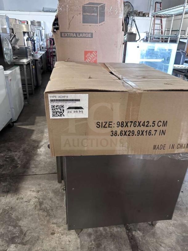 Brand new Atosa ACHP-6, 6-burner commercial gas hot plate in box. Size: 98x76x42.5 cm. Heavy-duty restaurant equipment.
