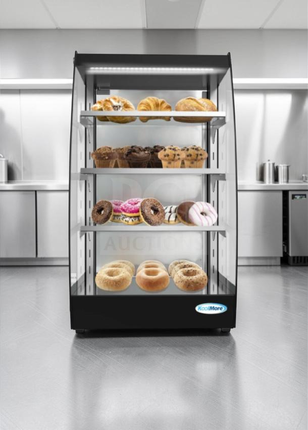 Brand new KoolMore DC-3CB countertop bakery display case with LED lighting. Features three shelves and KoolMore logo.