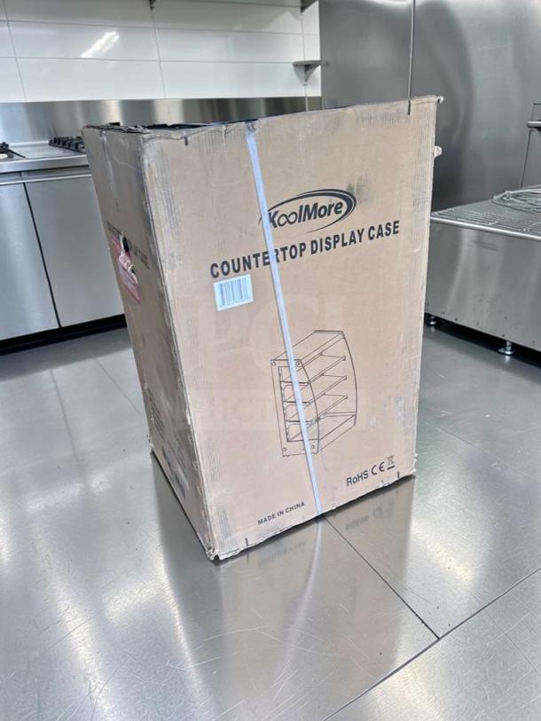 KoolMore DC-3CB countertop bakery display case in original box, new condition, LED pastry merchandiser, model KOO-M-DISP-0700.