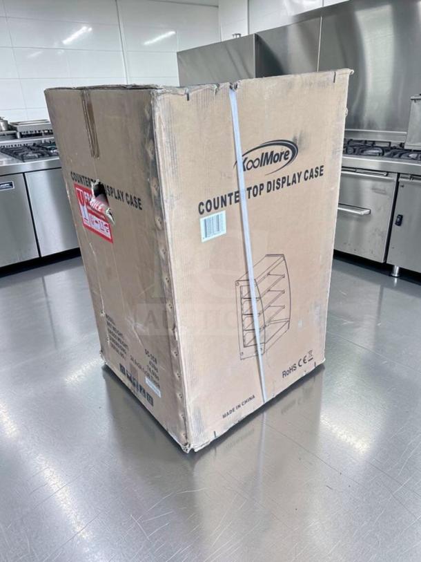 KoolMore DC-3CB countertop bakery display case, new condition, boxed with labels. Model: KOO-M-DISP-0700.