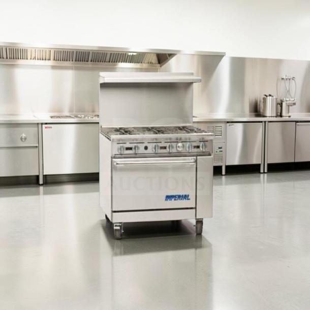 Imperial IR-6 36" commercial gas range with 6 burners and oven. Exceptional condition, natural gas, fully tested. Model: IMP-L-RANGE-0874.