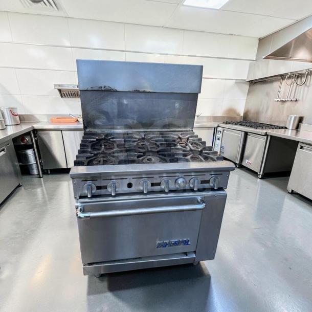 Exceptional condition 36" Imperial IR-6 commercial gas range with 6 burners and oven. Heavy duty, natural gas, fully tested.