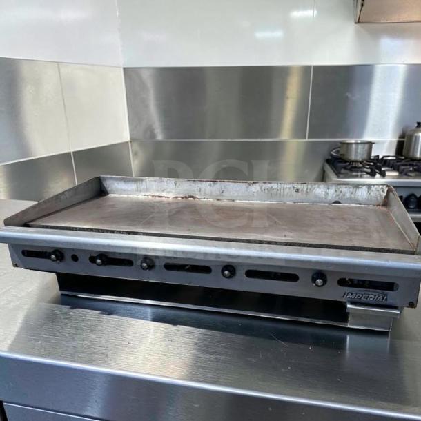 Imperial ITG-60 60" gas griddle with 1" steel plate, thermostatic controls, natural gas, superior condition, model IMP-L-GRID-0876.