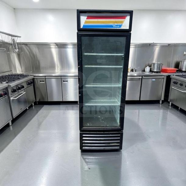 True GDM-23-HC 27" commercial glass door merchandiser in black, outstanding condition, with LED lighting.