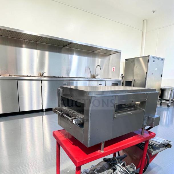 Star Holman QT14 conveyor sandwich toaster oven on red cart. Stainless steel, heavy-duty, fully operational, 208/240V.