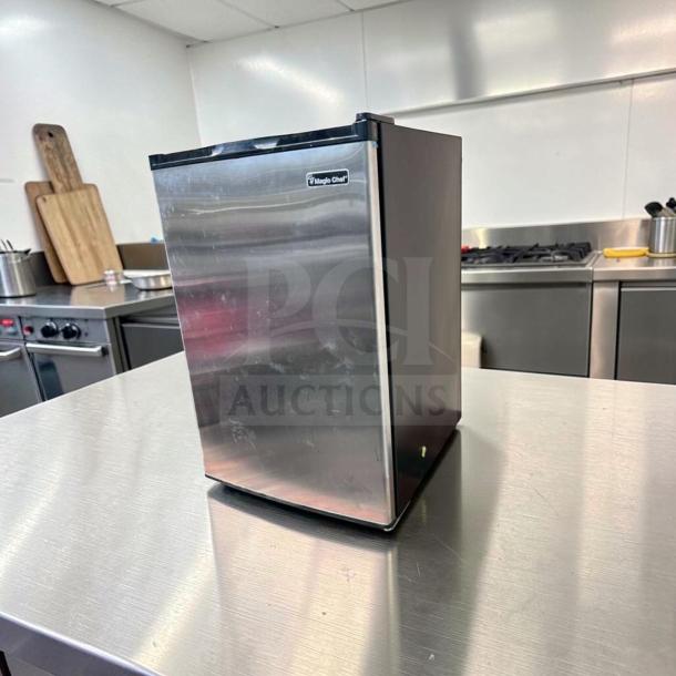 Magic Chef MCUF3S2 compact stainless steel upright freezer, 3 cu. ft., excellent condition, fully operational, space-saving design.