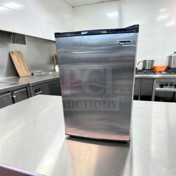 Magic Chef MCUF3S2 3 Cu. Ft. stainless steel upright freezer, compact design, excellent condition, fully tested, logo visible.