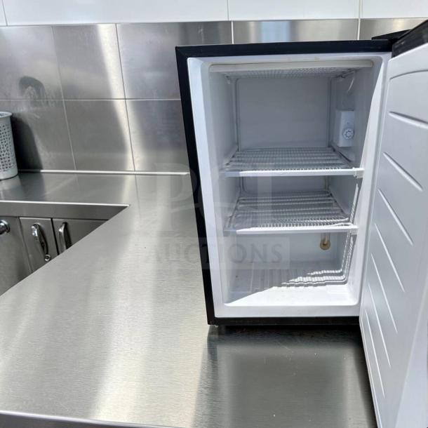 Magic Chef MCUF3S2 3 Cu. Ft. compact upright freezer, stainless steel, excellent condition, space-saving, fully operational.