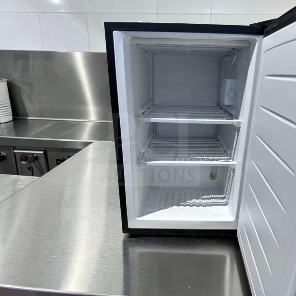Magic Chef MCUF3S2 3 Cu. Ft. stainless steel upright freezer, excellent condition, interior shelves, fully operational.