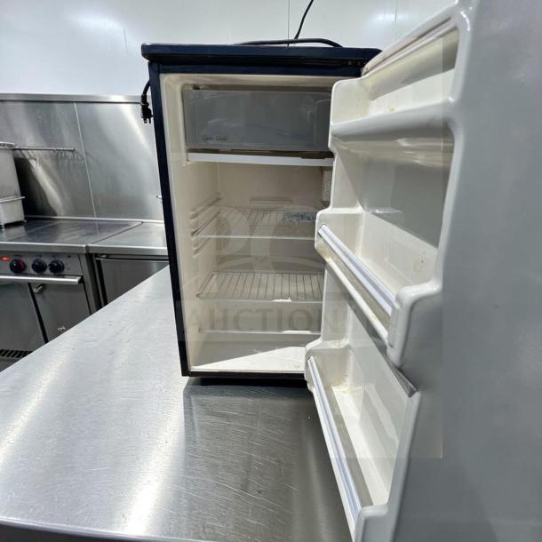 Euro-Gold W-995 undercounter mini fridge, space-saving, shelves visible, fully operational, 115V, model EUR-S-FR-0884.