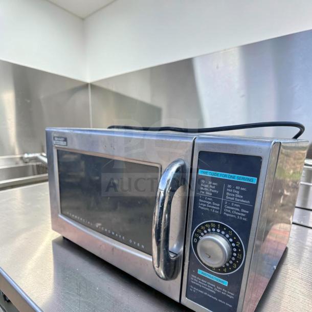 Sharp R-21LCFS commercial microwave oven, stainless steel, 1000W, dial control, fully tested, excellent condition, 120V.