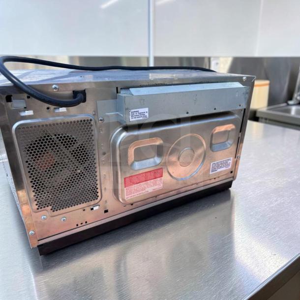 Sharp R-21LCFS Commercial Microwave, stainless steel, 1000W, dial control, top-tier condition, tags visible, fully tested.