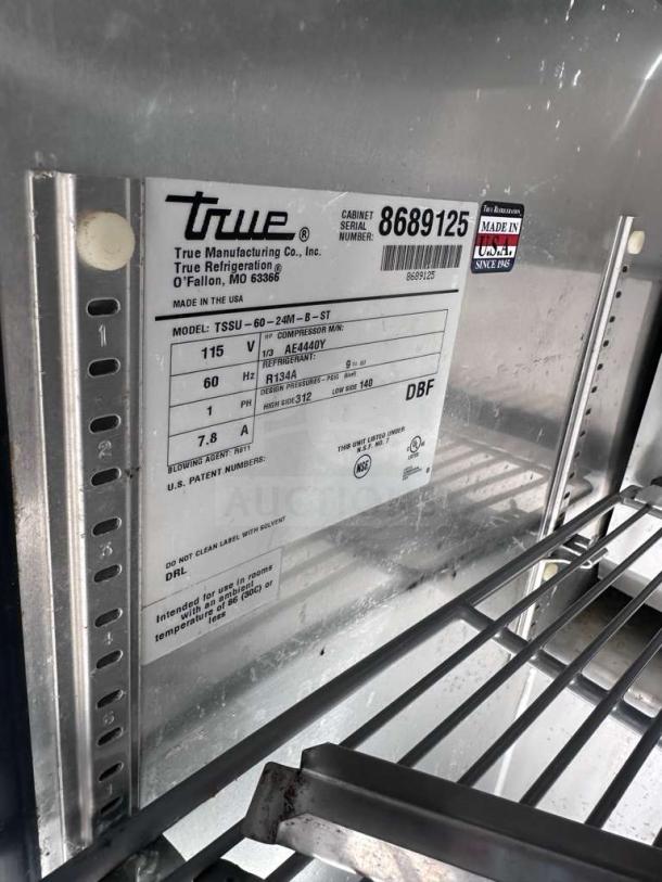 True TSSU-60-24M-B-ST-HC Mega Top prep table label with model, voltage, and refrigerant details. Made in the USA.