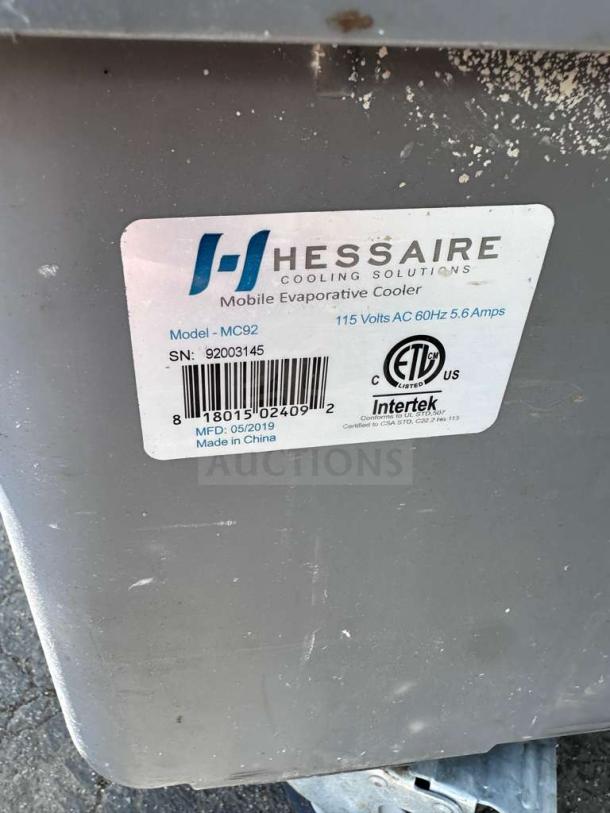 Hessaire MC92V Mobile Evaporative Cooler label showing model, serial number, voltage, and manufacture date.